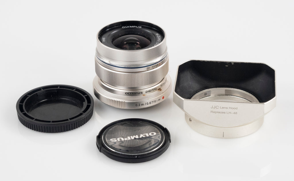 Zuiko 12/2 micro four thirds lens with lens hood - $250